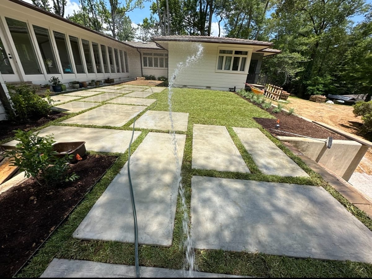 Finished concrete paver walkway with fresh sod