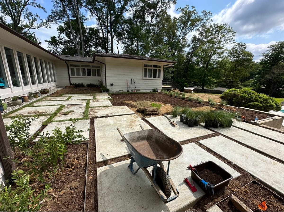 Backyard mid-renovation with bare ground