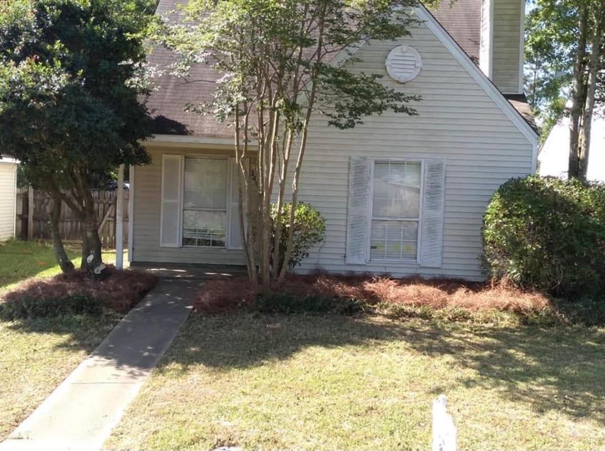 Shrubs cleared and house front opened up
